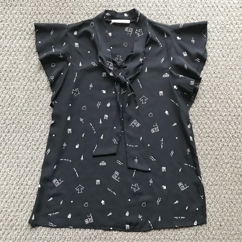 Les Amis Black & White French Icons Printed Ruffle Blouse With Self Neck Tie